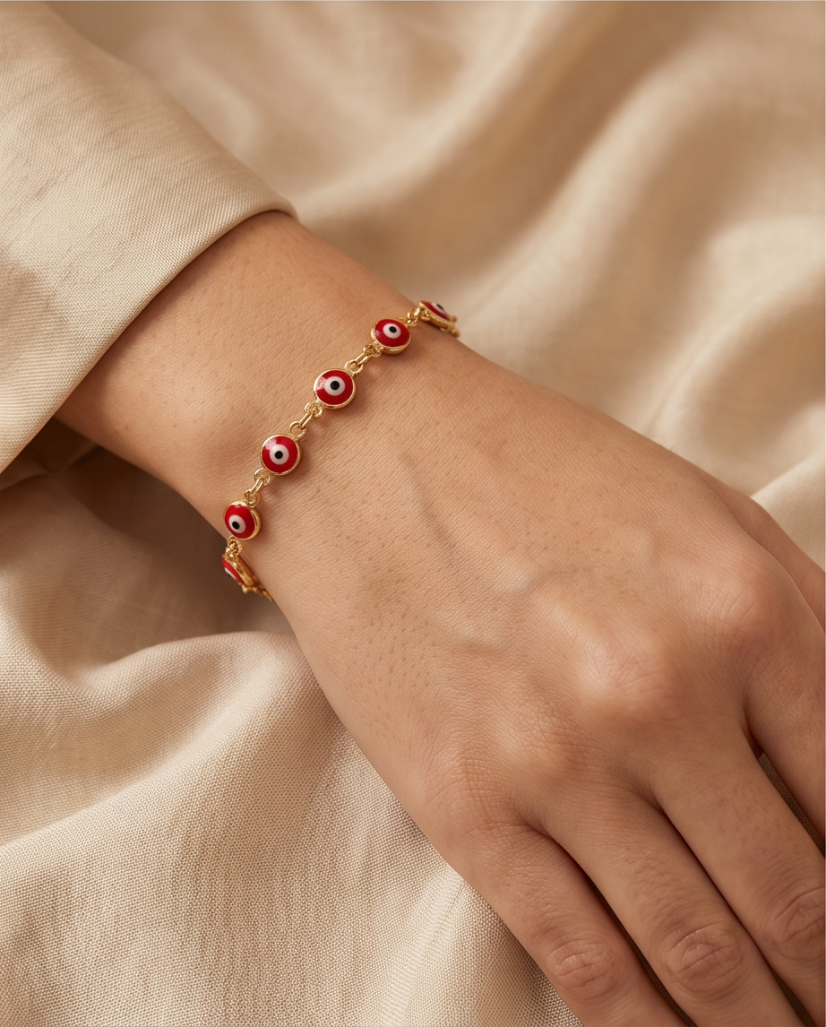PULSERA CON OJITOS ROJA