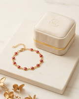 PULSERA CON OJITOS ROJA