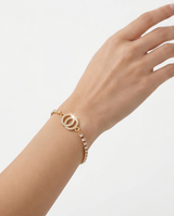 Pulsera de fantasia con dijes plateados