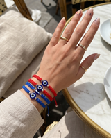 SET DE PULSERAS POR 12 CON OJITOS
